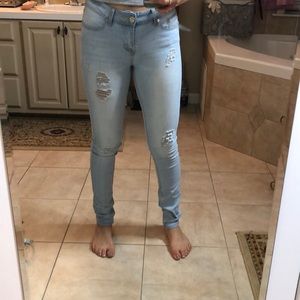 Light blue ripped jeans